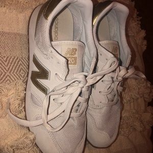 Gold and white New Balances